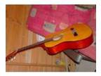 acoustic guitar. i am selling an acoustic guitar for....