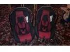2 car seats suitable from birth. 2 red and black car....